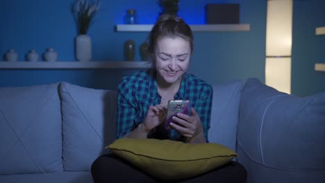 Phone-addicted-woman-at-home-at-night.
